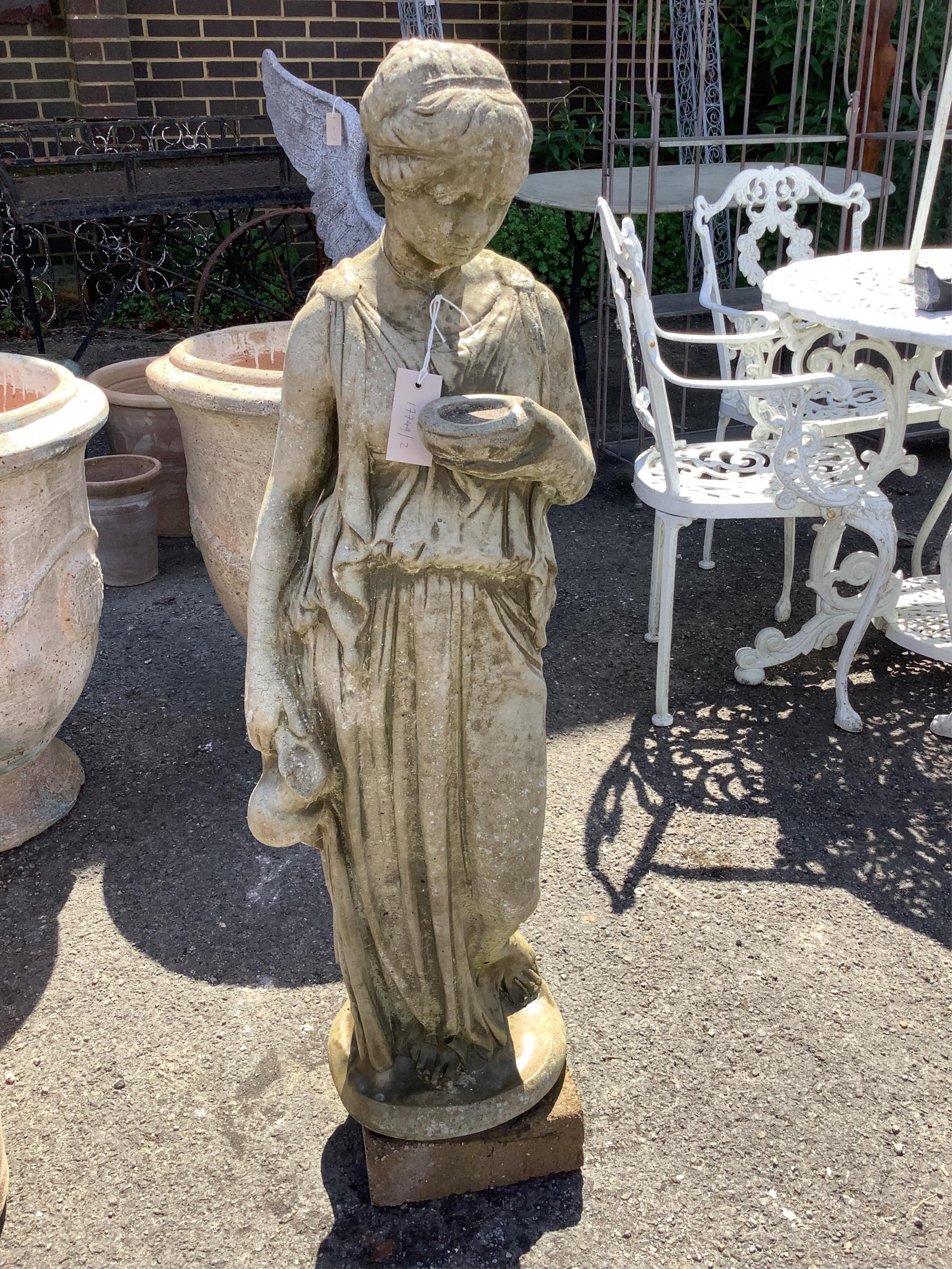 A reconstituted stone female water carrier garden ornament, height 106cm